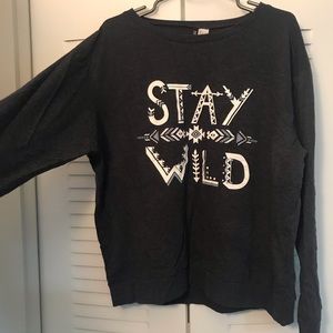 Long sleeved, blue-gray graphic top